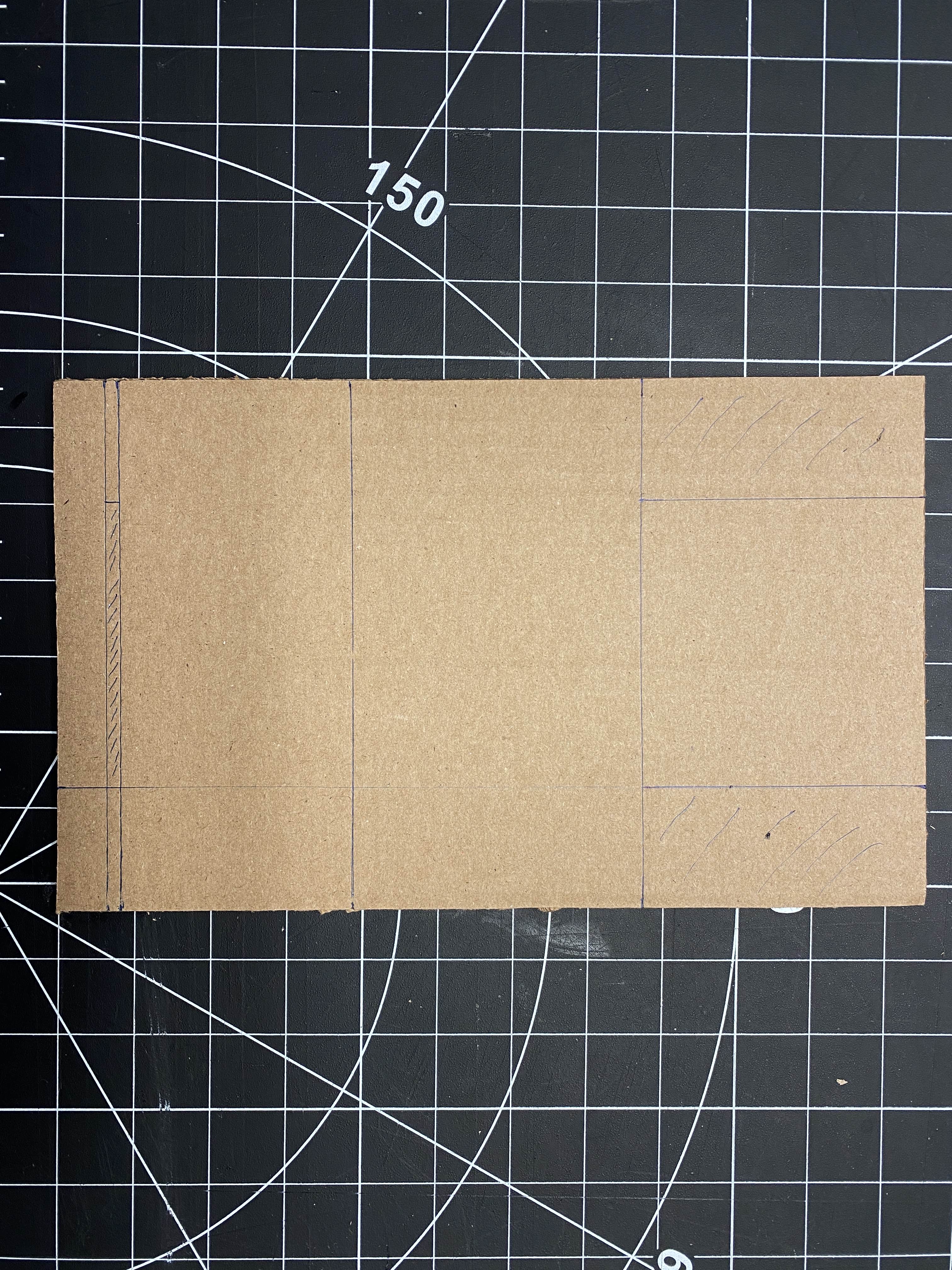 Marking where to cut using the exacto-knife.